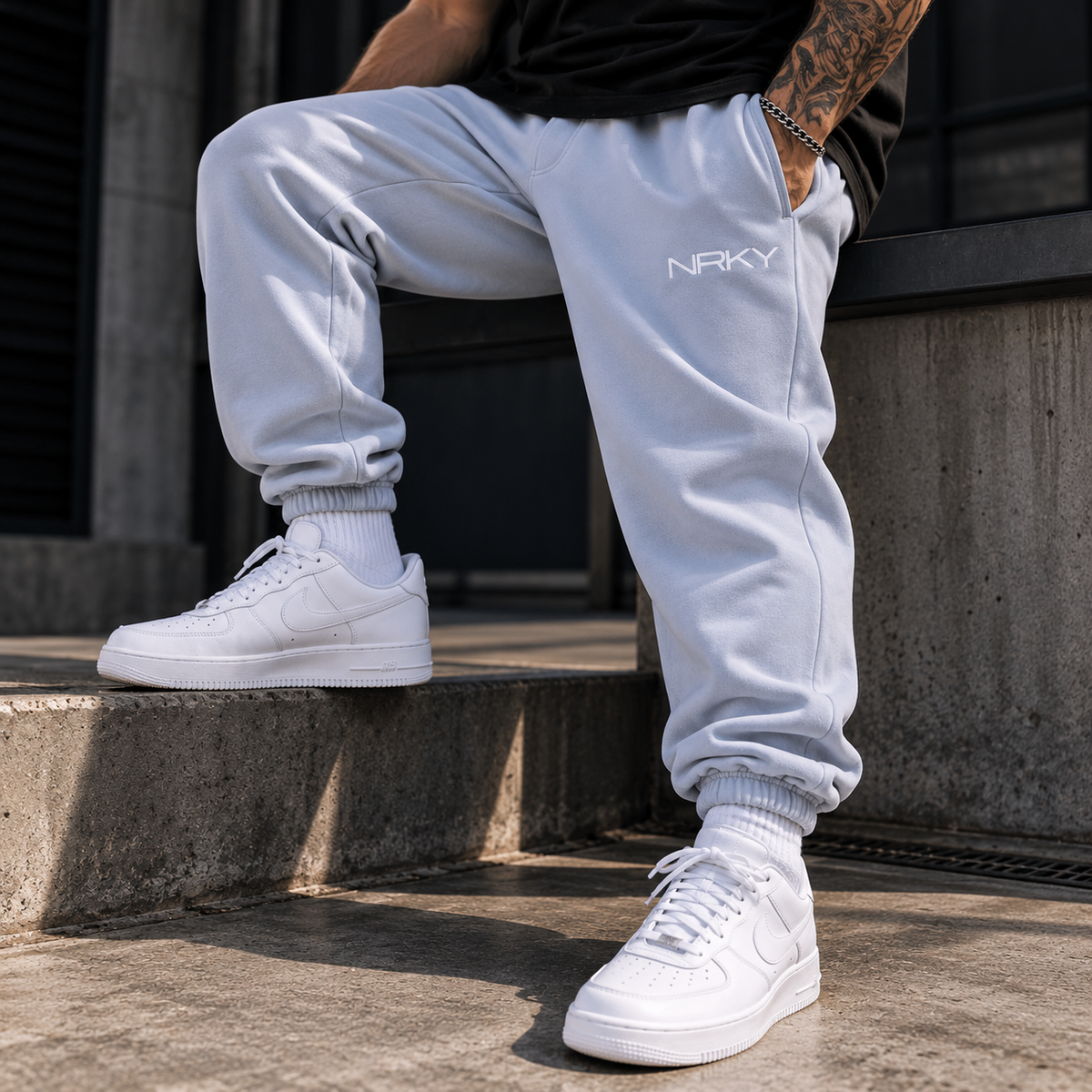 Men's Anarchy powder blue tracksuit pants on model