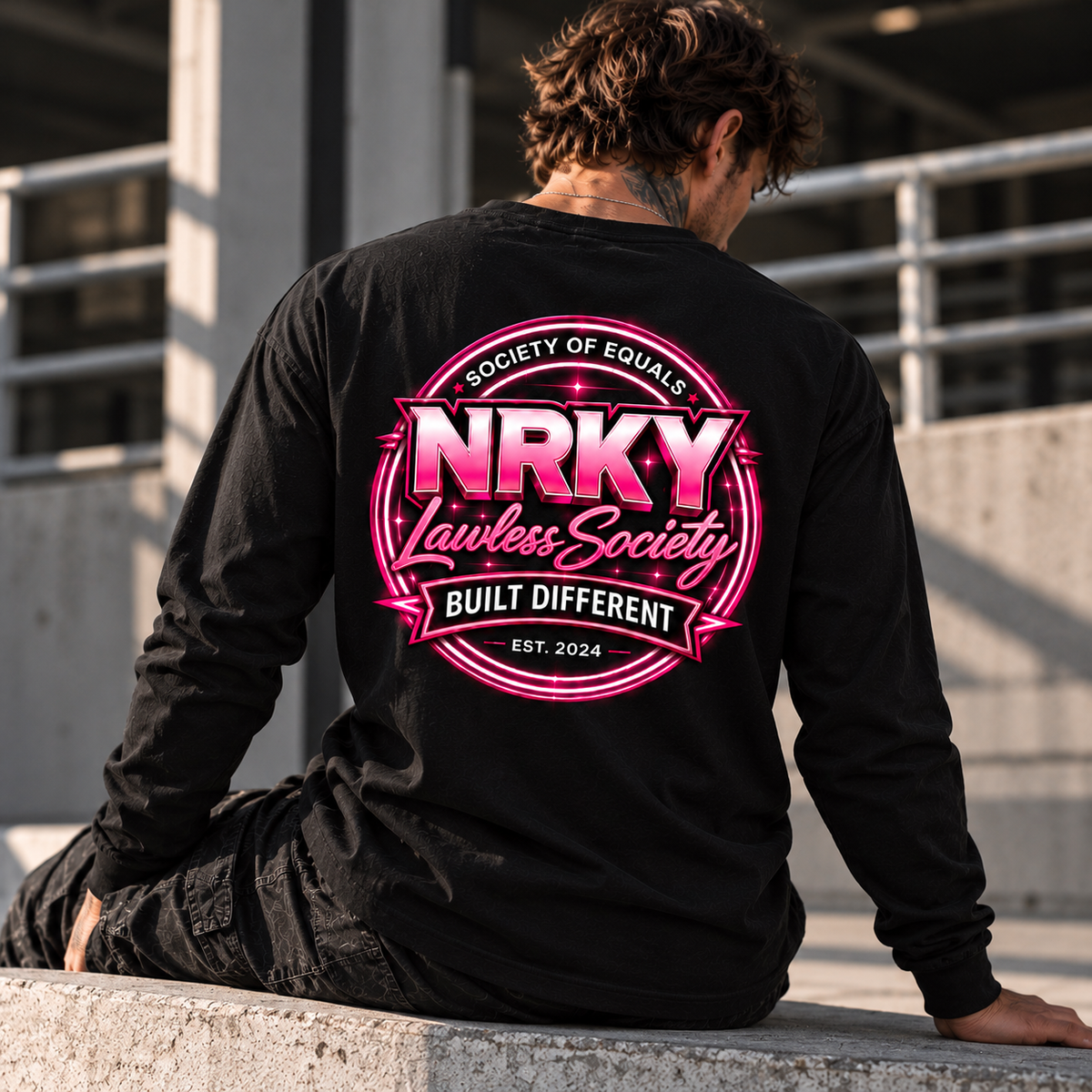 Men's black Sinister Pink long sleeve tee with hot pink NRKY Lawless Society back graphic