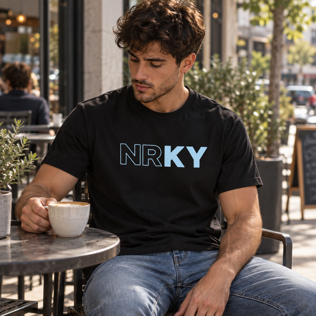 Men’s Revolution Tee with powder blue NRKY logo on black
