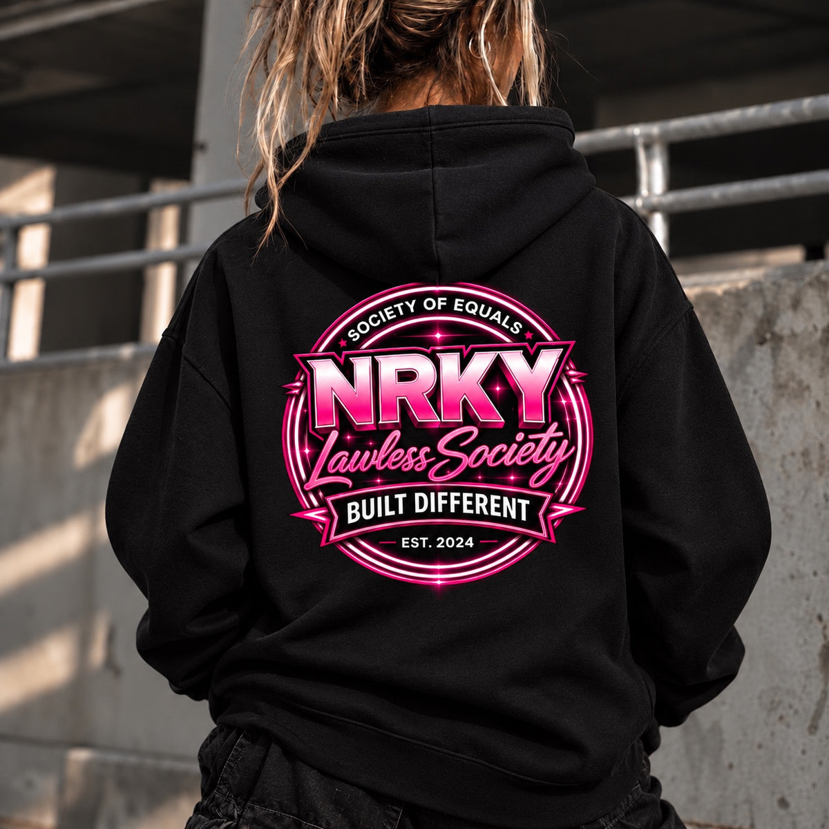 Women's black Sinister Pink hoodie with hot pink NRKY Lawless Society back print